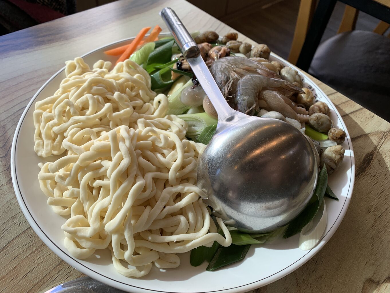 a bowl of noodles and vegetables