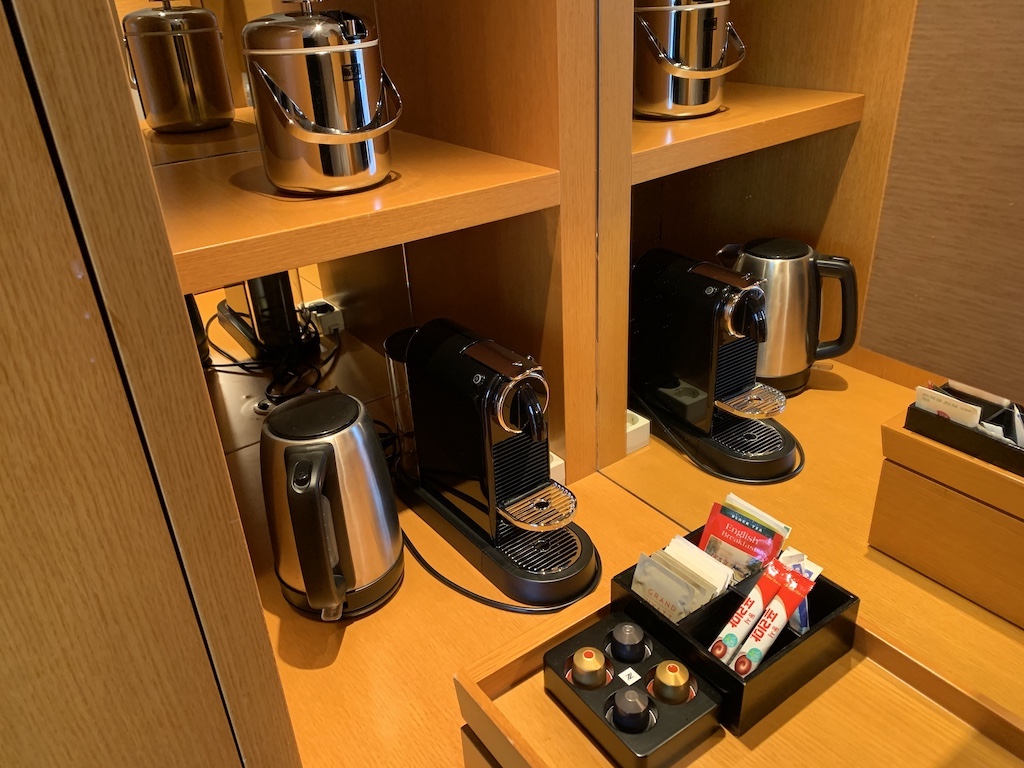 a coffee table with coffee maker and coffee maker