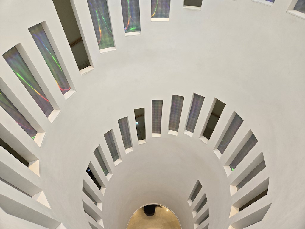 a white ceiling with a spiral staircase