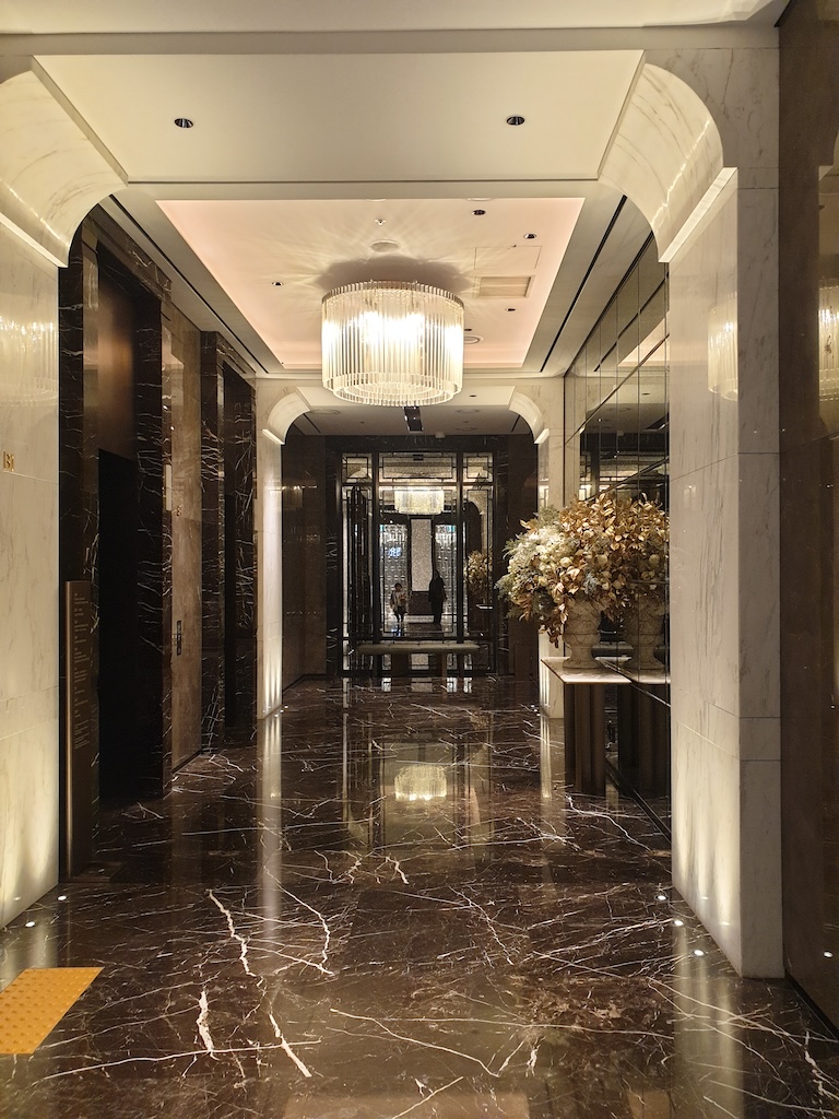 a hallway with a large glass door