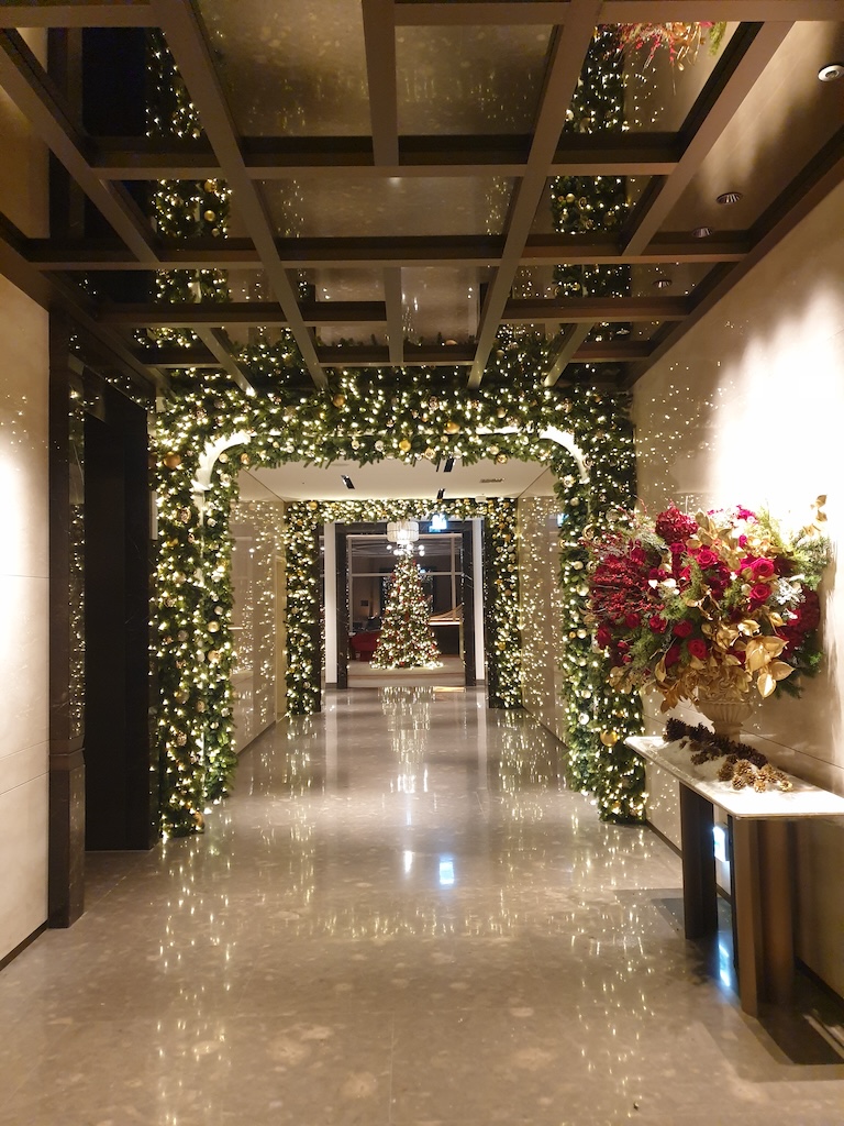 a hallway with flowers and plants