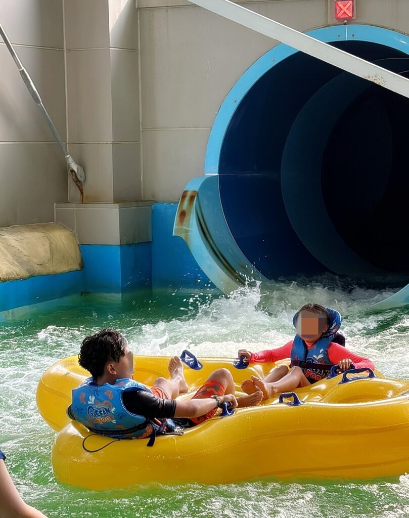 a group of people in a water park