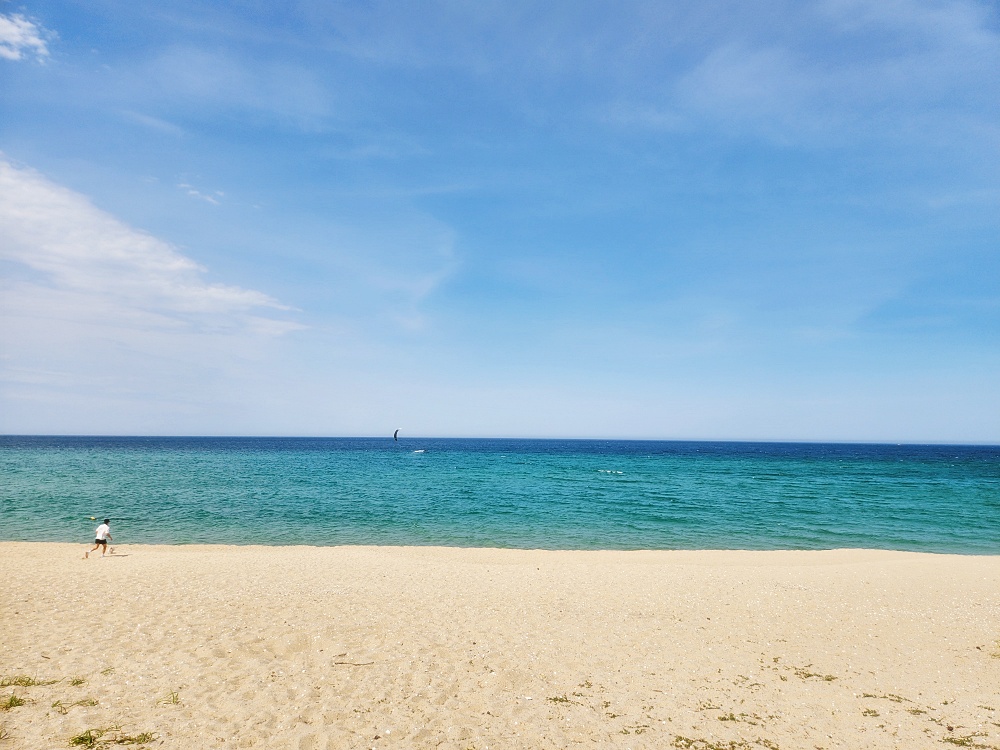 a person walking on a beach