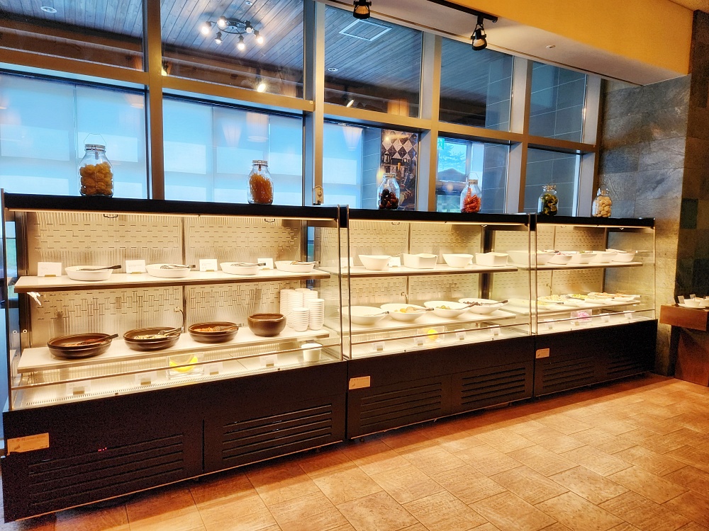 a kitchen with many bowls and plates