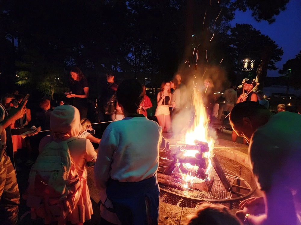 a group of people around a fire