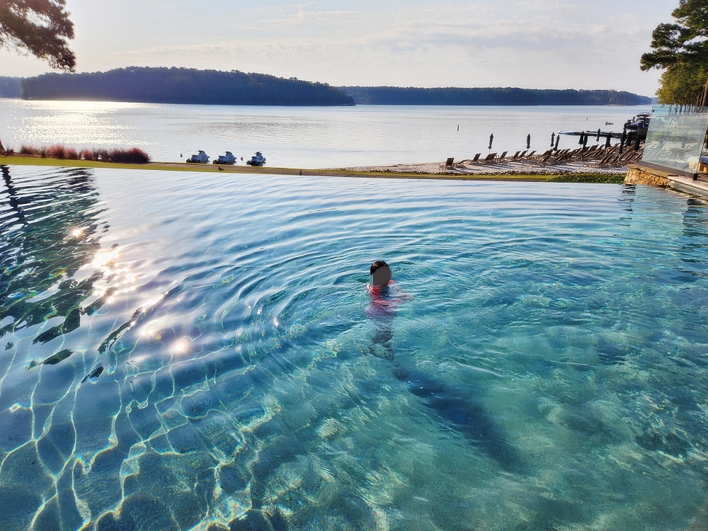 a person swimming in a large body of water