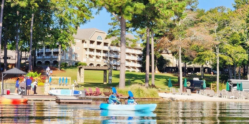 a body of water with boats and trees around it