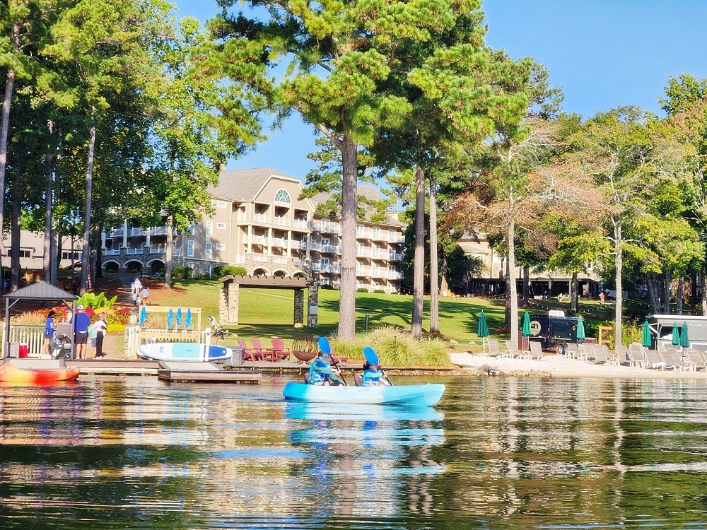 a body of water with boats and trees around it