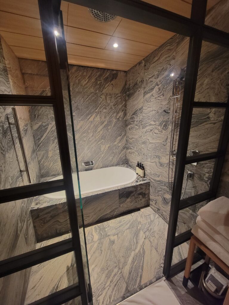 a bathroom with a tub and a sink