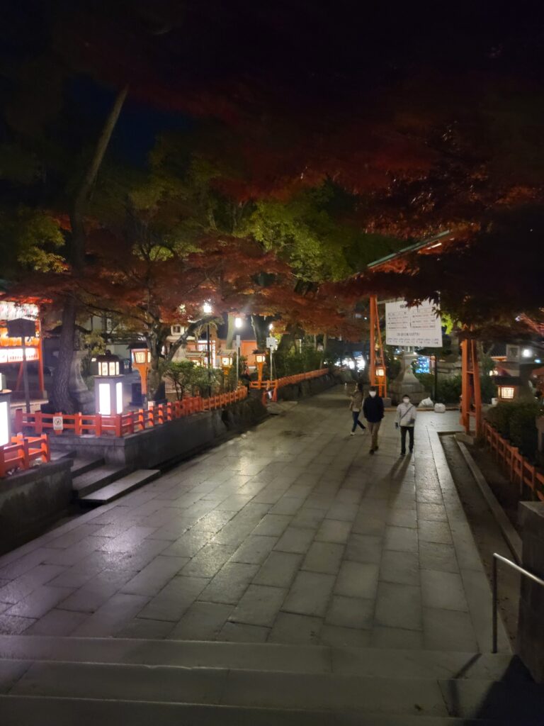 people walking on a sidewalk