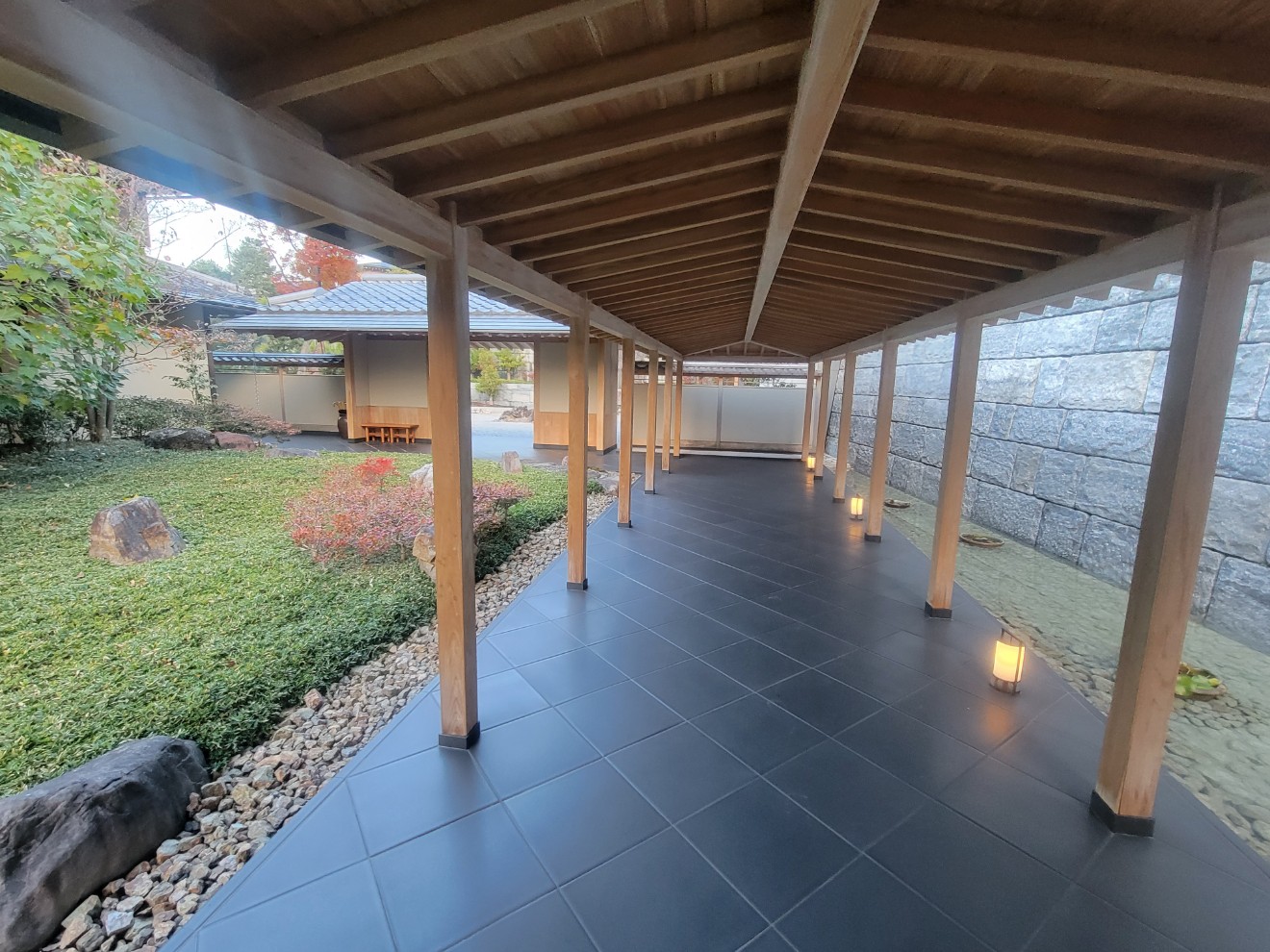 a covered patio with a stone patio