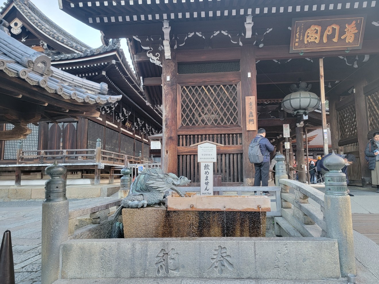 a person standing next to a building