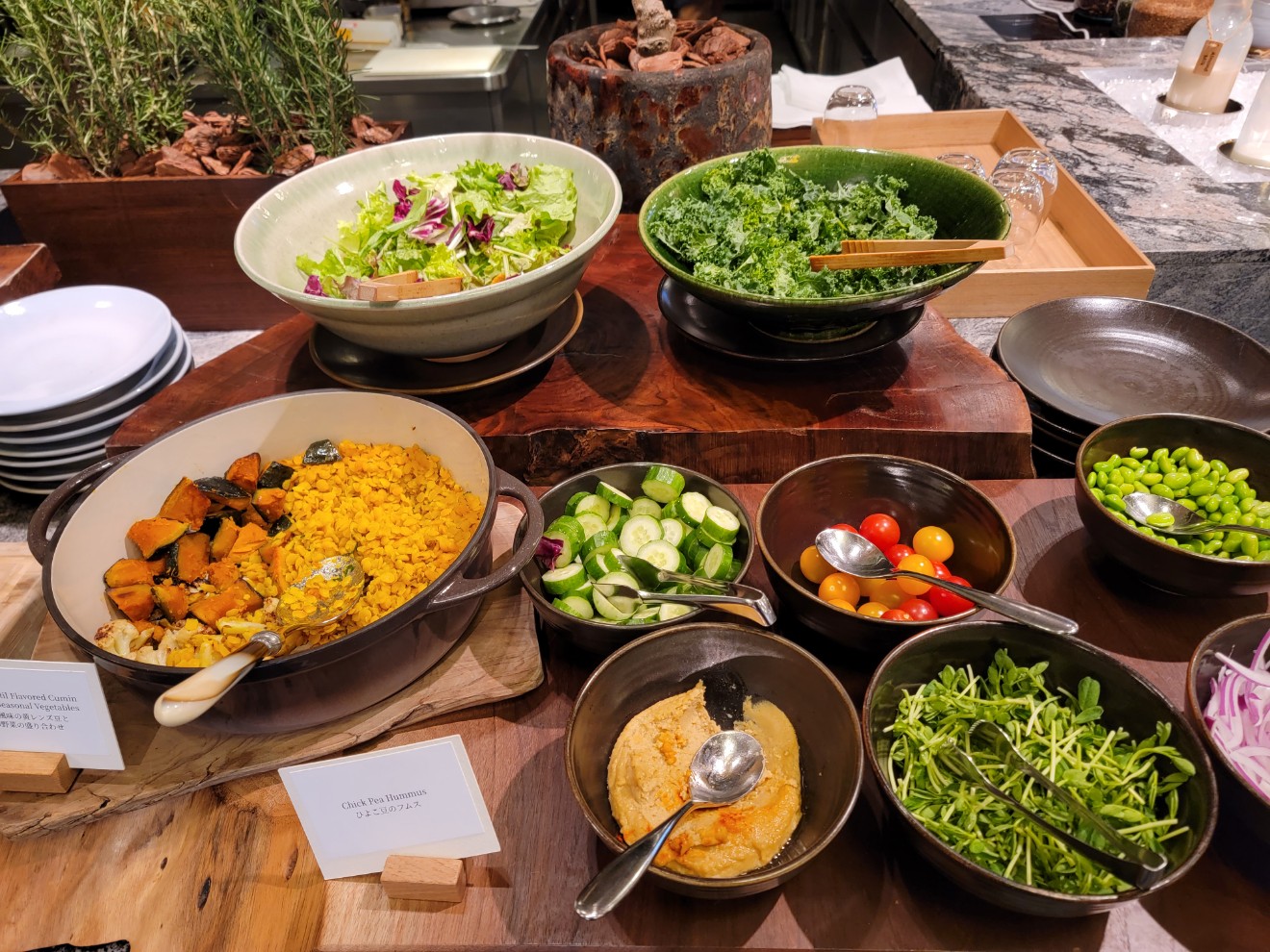 a table full of bowls of food