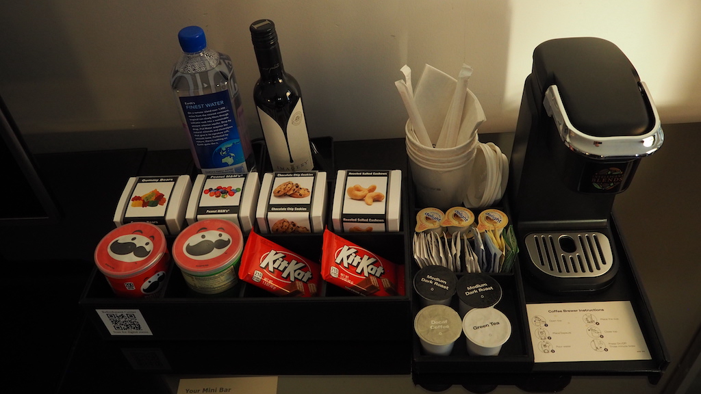 a shelf with food and drinks on it