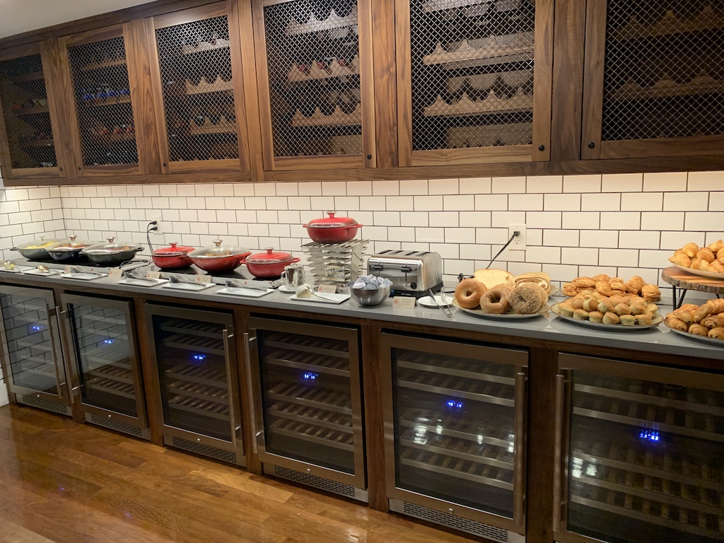 a kitchen with a counter top and many plates of food