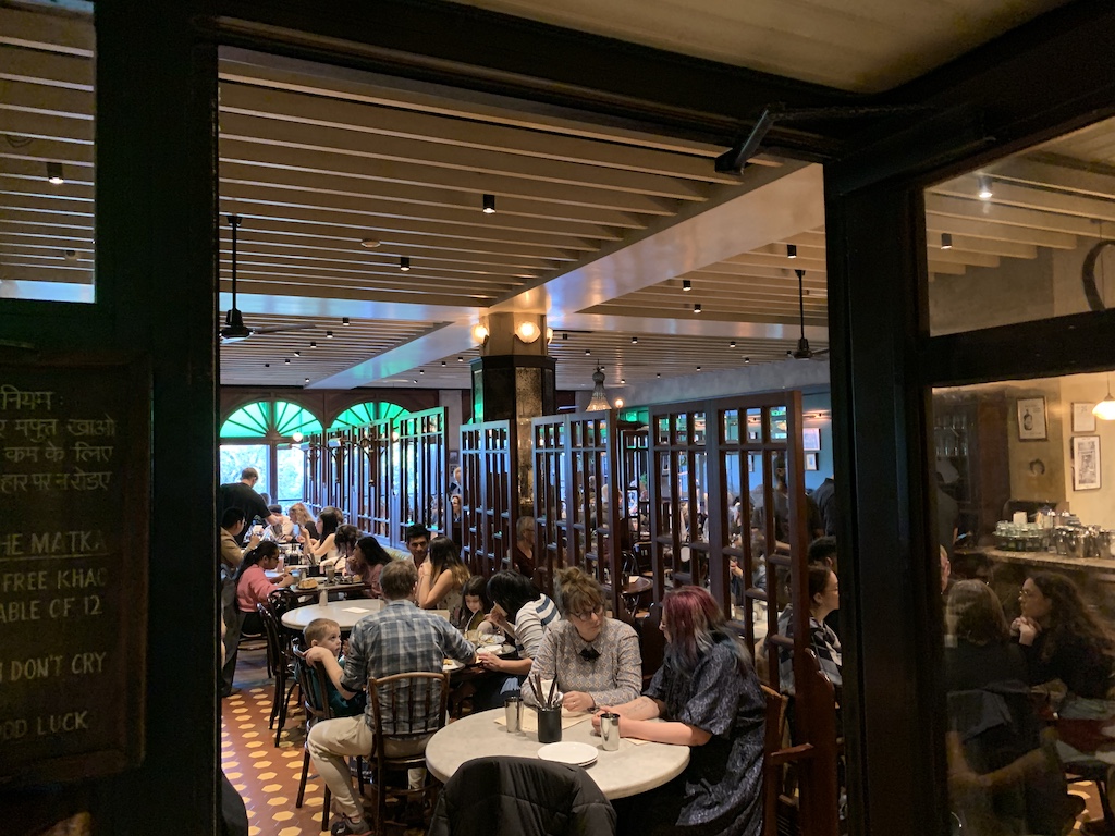 a group of people sitting at tables