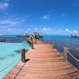 a dock with a boat in the water