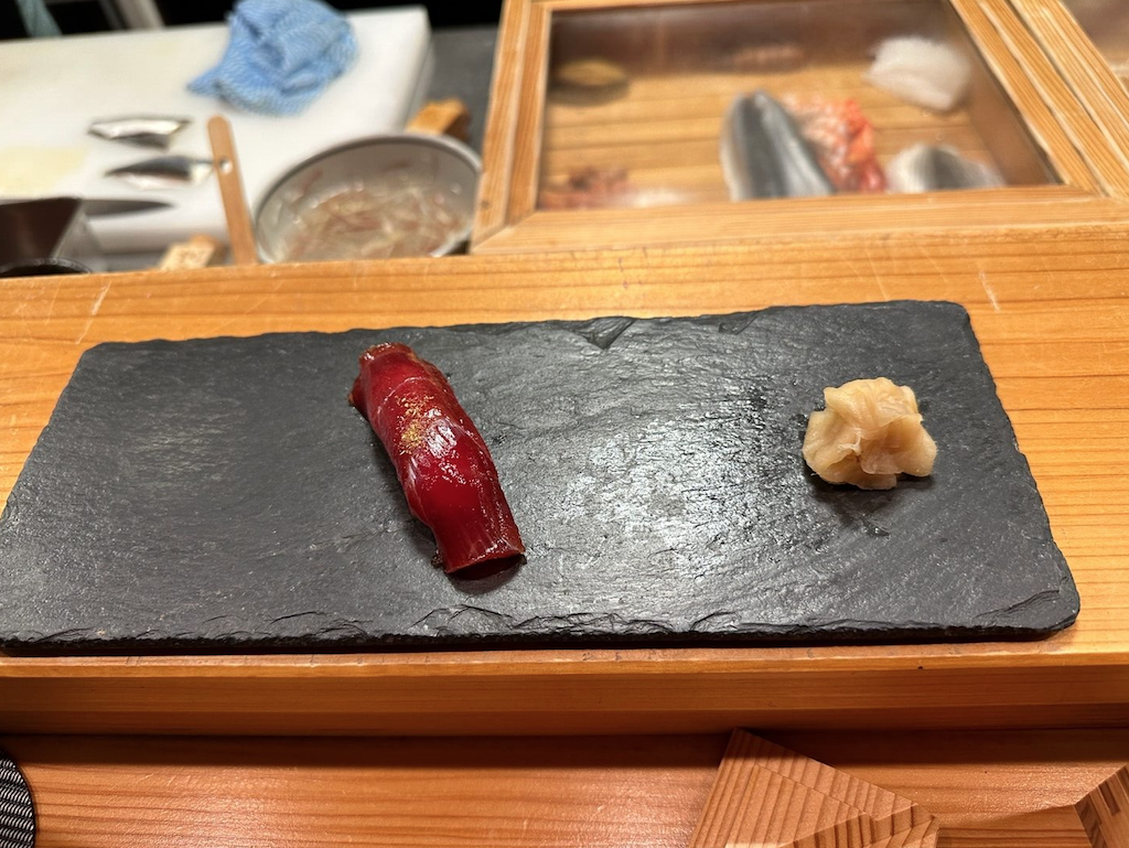 a red and white object on a black surface