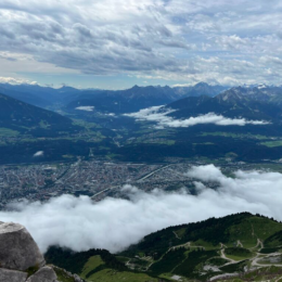 a view of a valley with a river running through it