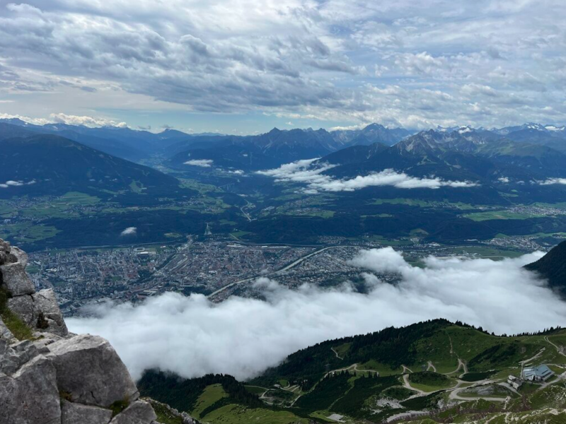 a view of a valley with a river running through it