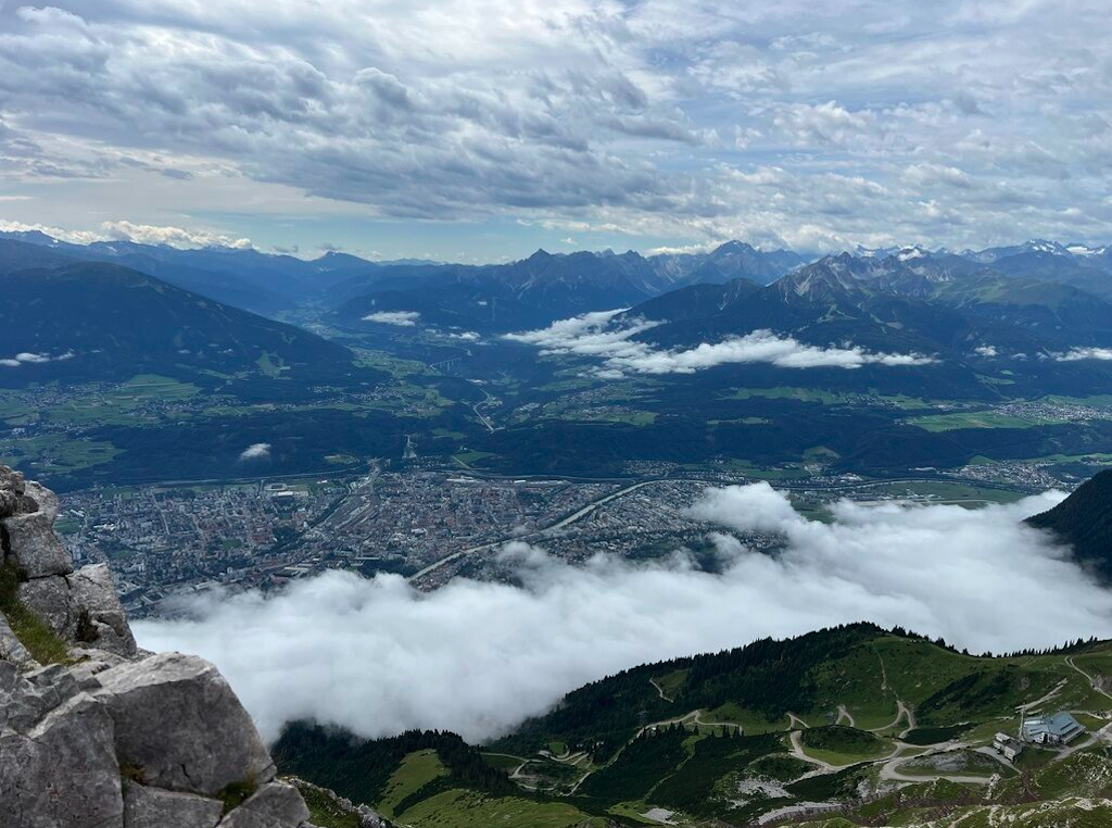 a view of a valley with a river running through it