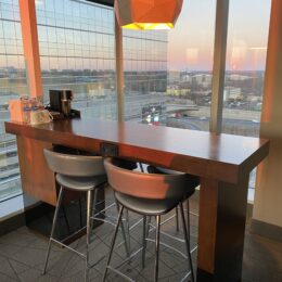 a table with chairs and a window