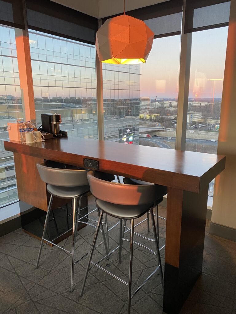 a table with chairs and a window