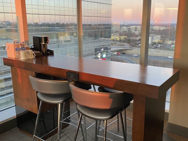 a table with chairs and a window