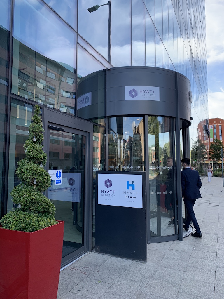 a glass building with a sign on the front