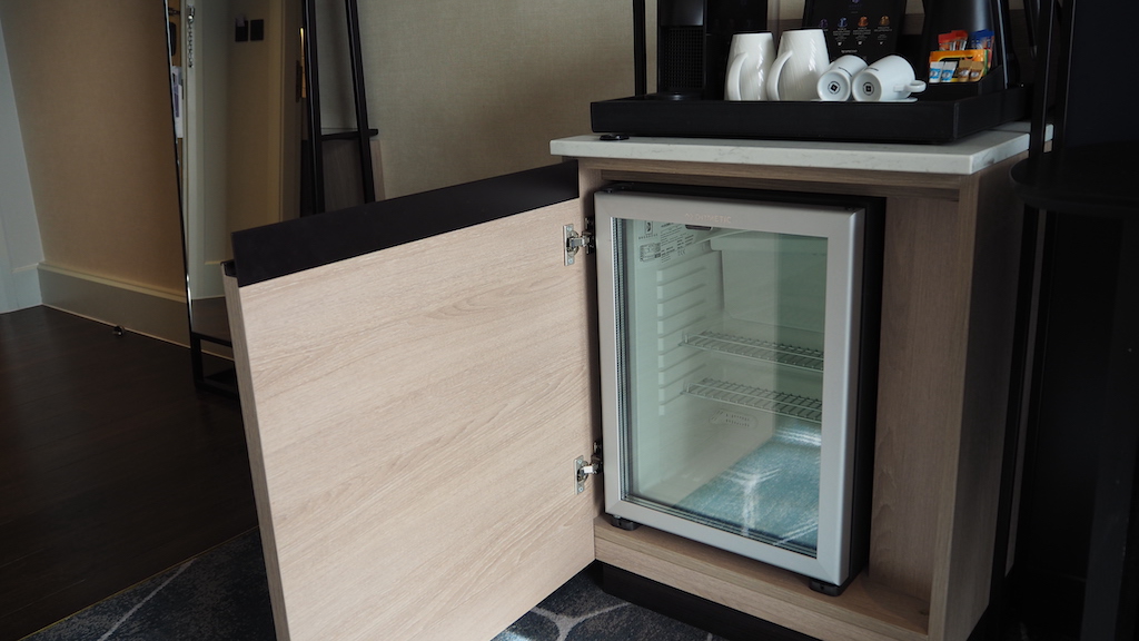 a cabinet with a glass door