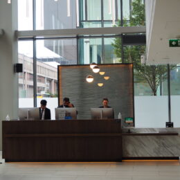 a group of people sitting at a table in front of a building