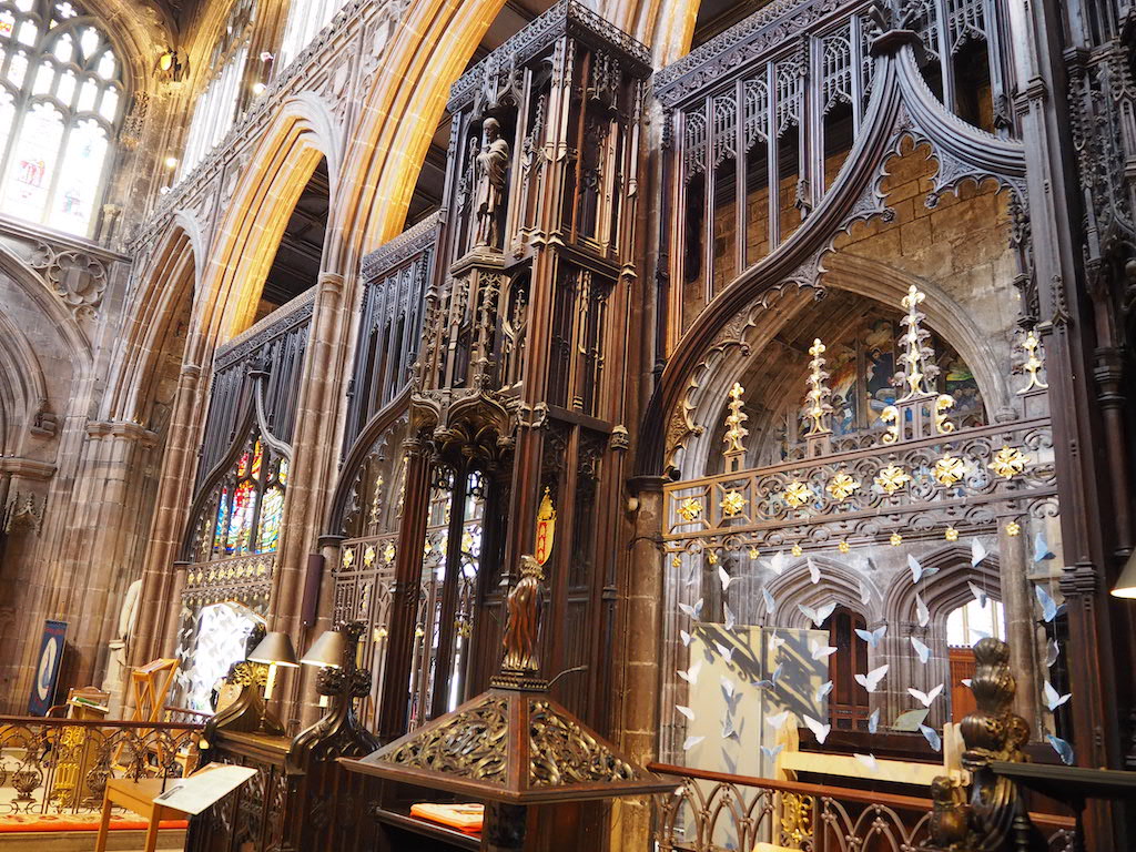 a large ornate clock in a church