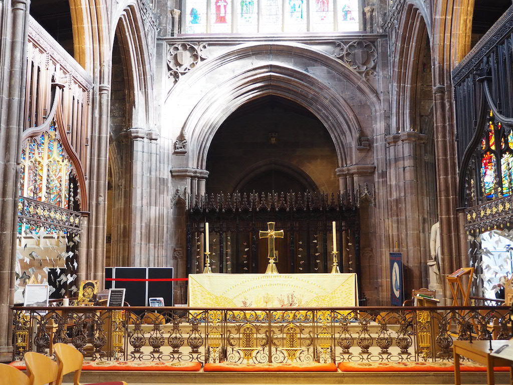 a large ornate gold alter in a church