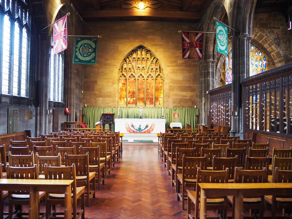 a large room with rows of tables and chairs