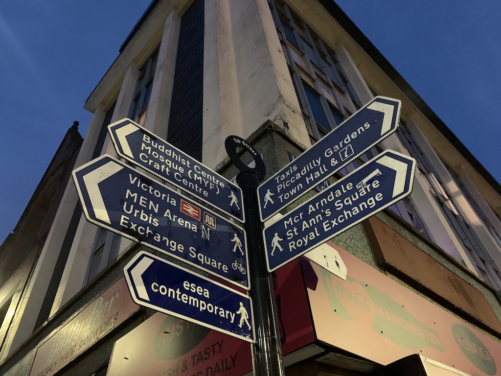 a street sign is posted on a pole