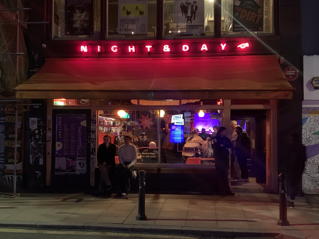 a group of people outside a restaurant