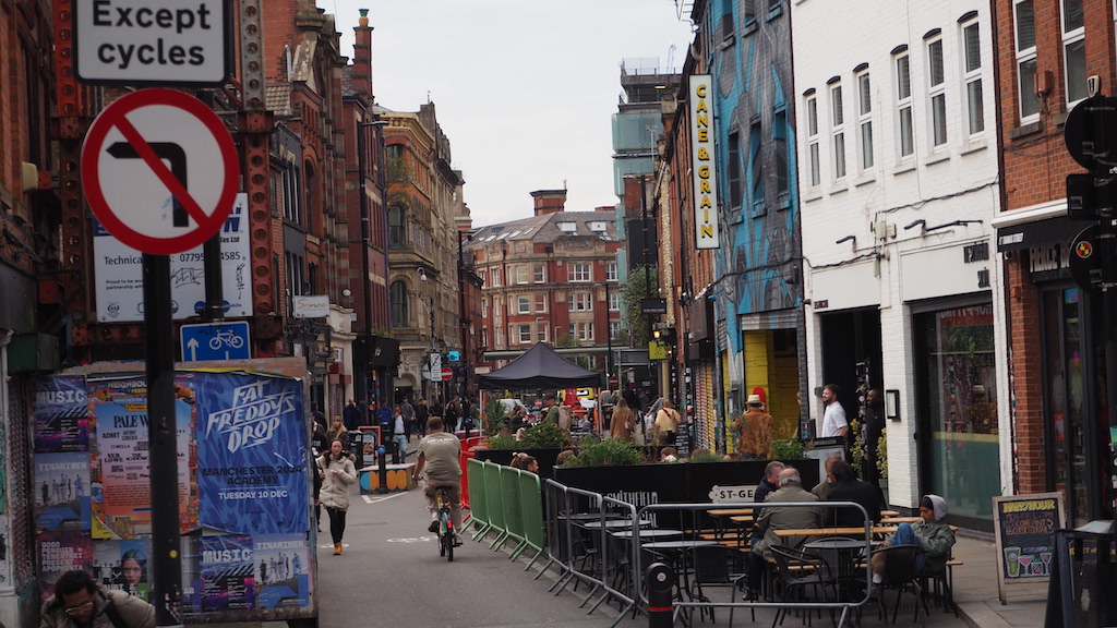 a busy street with people and bikes