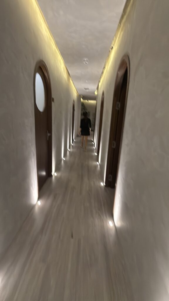 a person walking down a hallway