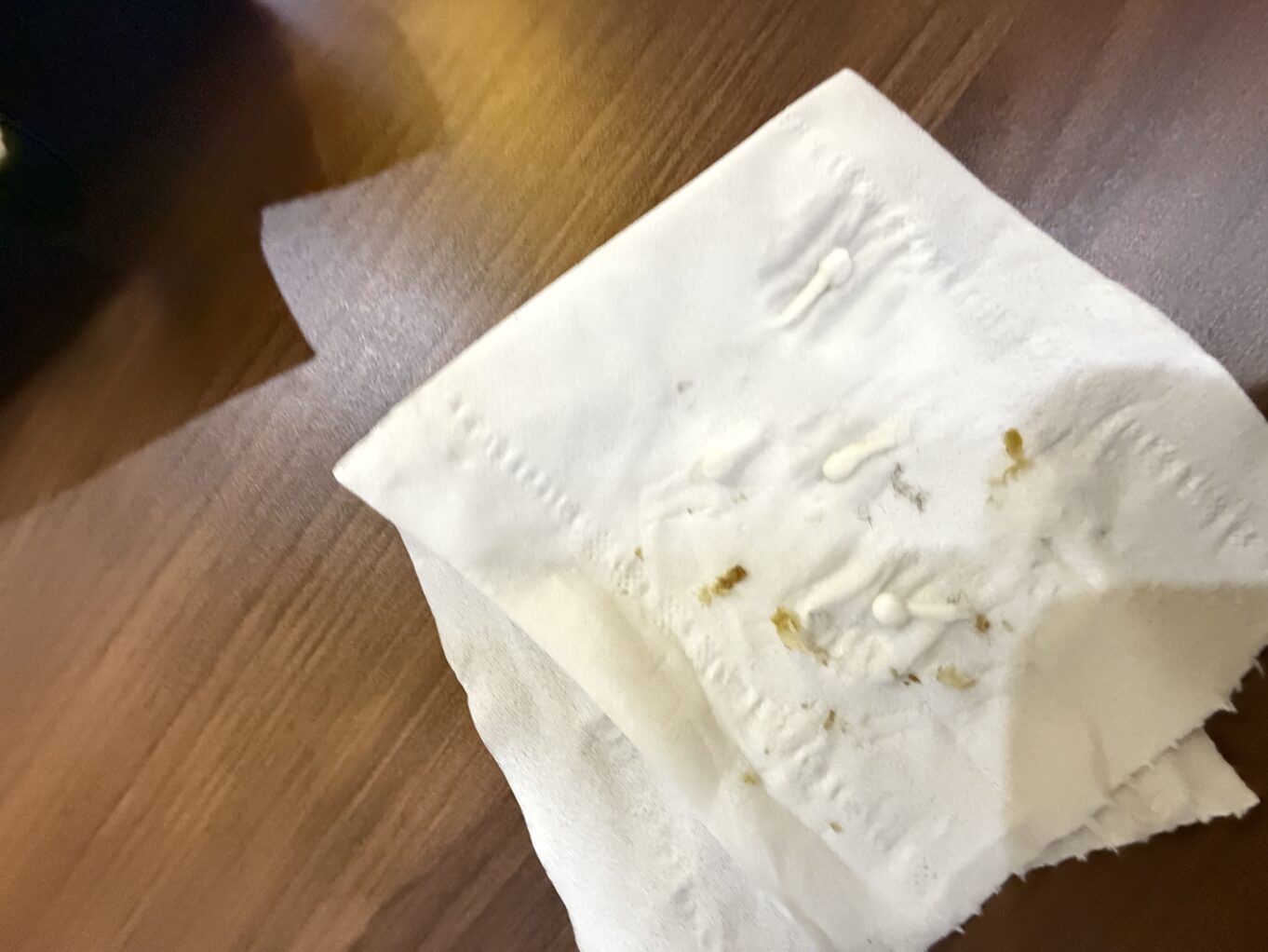 a white tissue paper on a wooden surface