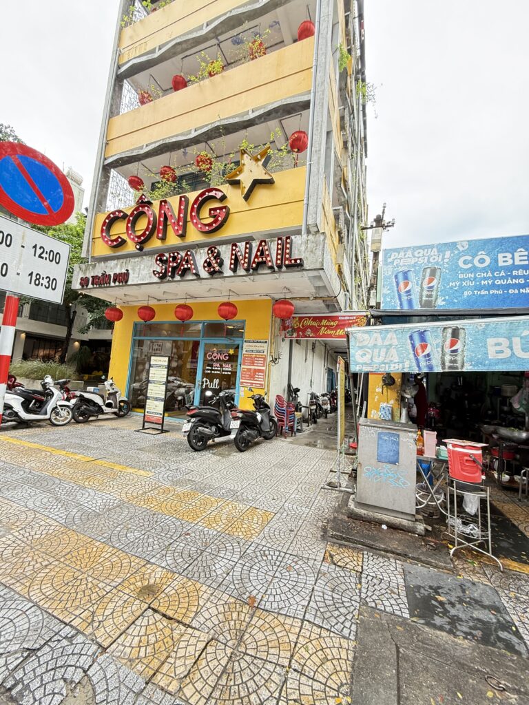 a store front with motorcycles parked in front