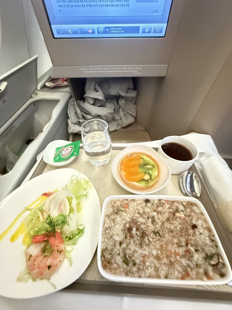 a table with plates of food and a tv