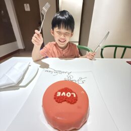 a boy eating a cake