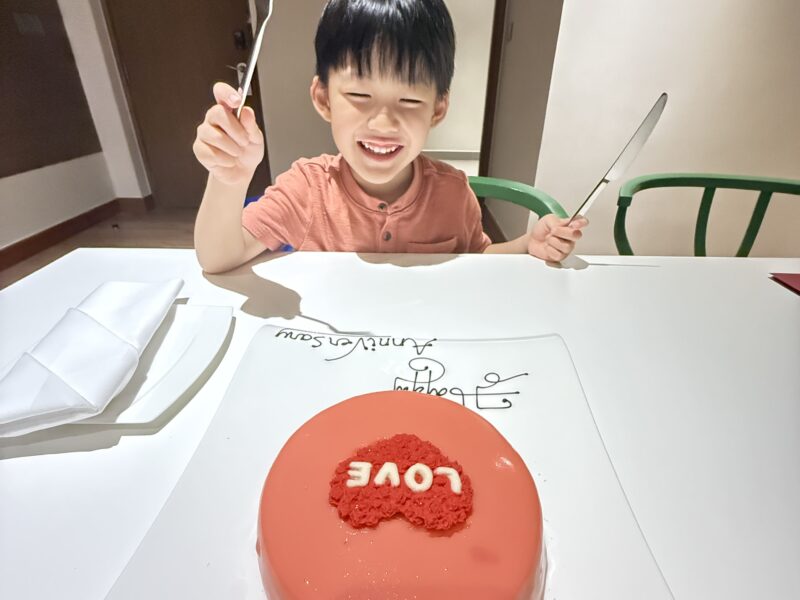 a boy eating a cake