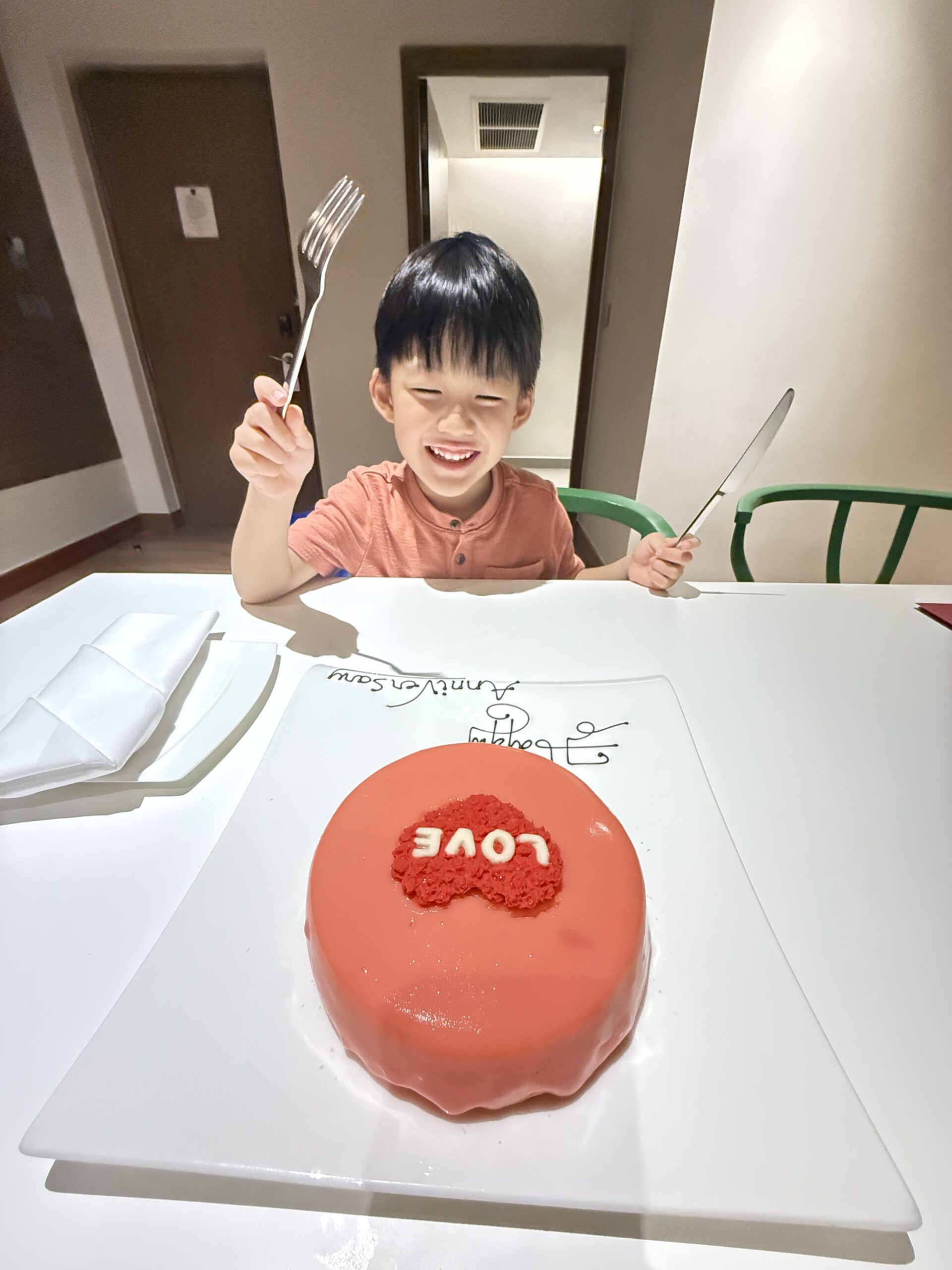 a boy eating a cake