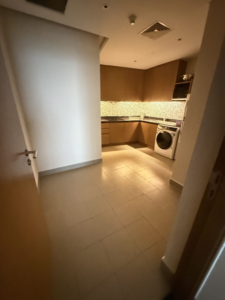 a kitchen with a sink and a refrigerator