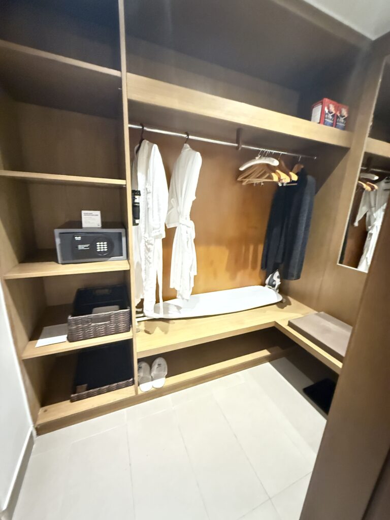 a closet with clothes and clothes