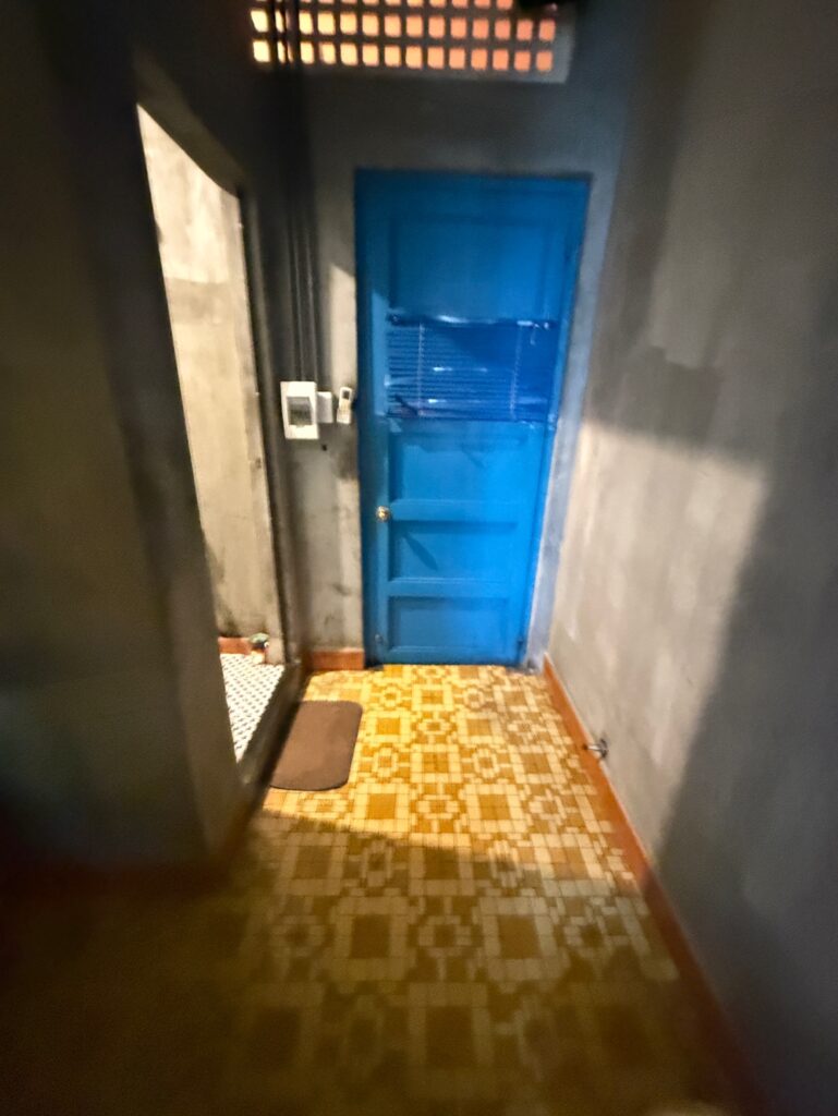 a blue door in a hallway