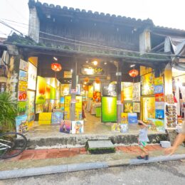 a building with signs and lanterns