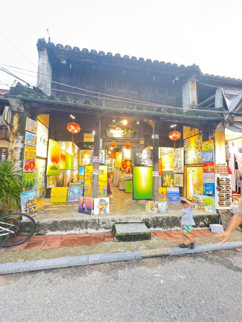 a building with signs and lanterns