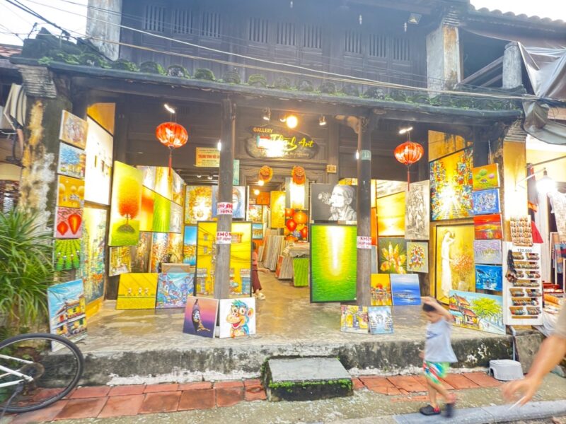 a building with signs and lanterns